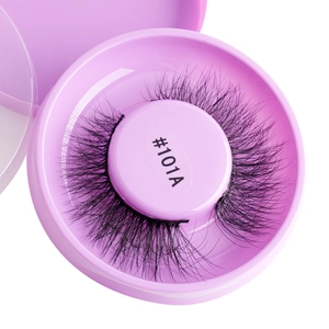 Macro shot of thick curly #101A adhesive-free false eyelashes in a pink case