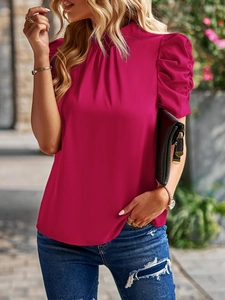 Detail of elegant rose red chiffon blouse with puff sleeves and stand collar on model