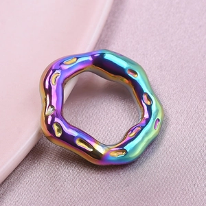 Macro shot of 304 stainless steel lava pendant with 18k gold plating and rainbow finish