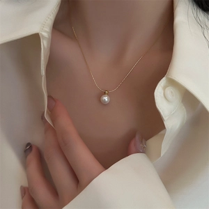 Minimalist single pearl pendant necklace with a delicate 18K gold plated chain on model