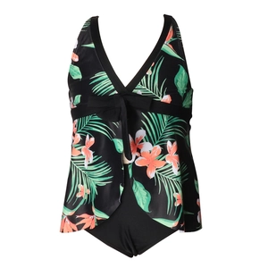 Close-up of tropical floral print tankini top with black bow detail and V-neckline