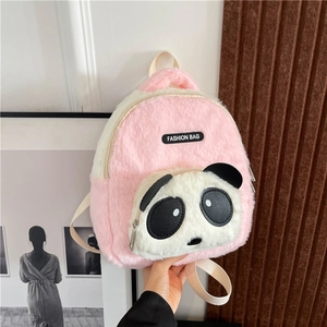 Close-up of pink plush panda backpack showing zipper pocket and fashion bag label