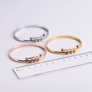Detailed macro view of three-color 304 stainless steel bangles with crystal slider accents