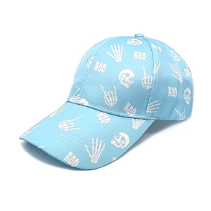 Detail of light blue baseball cap featuring a white skull and BOO graphic print