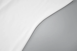 Detail showing the soft texture and draped fabric of white slim fit summer dress