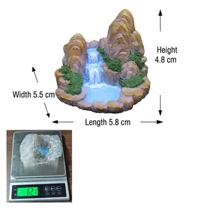 Miniature rockery fountain detail with dimensions 5.8x5.5x4.8cm and weight display
