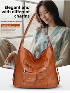 Brown vintage faux leather crossbody bag with multiple zippers shown in a casual lifestyle scene