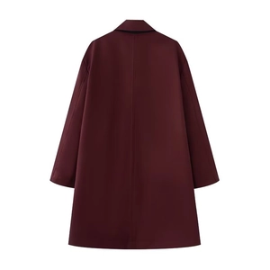 Detailed back view of a long burgundy coat with premium stitching and elegant drape