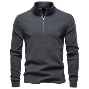 Close-up of charcoal grey fleece sweatshirt showing quarter-zip collar and soft texture
