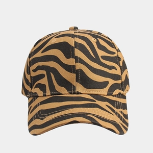 Detail shot of a baseball cap with a bold brown and black tiger pattern texture