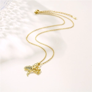 Golden stainless steel ginkgo leaf necklace with micro-pave zircons on a delicate O-chain