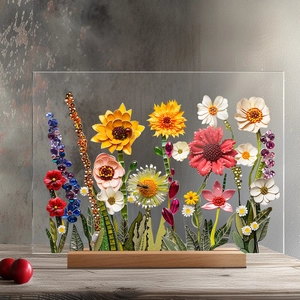 Macro shot of 3D floral paper art and beads embedded in clear acrylic with a wooden base