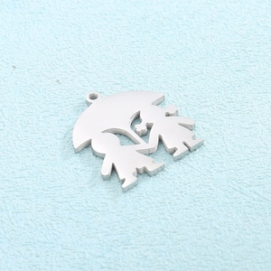 Macro detail of silver stainless steel umbrella pendant with smooth polished finish