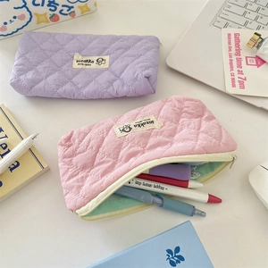 Quilted macaron color stationery pouches in pink and purple with contrasting lining