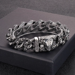 Vintage silver Cuban chain bracelet featuring a detailed cobra head clasp for men