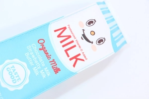 Close-up of cute cartoon milk box pencil case with pasteurized vitamin D milk prints