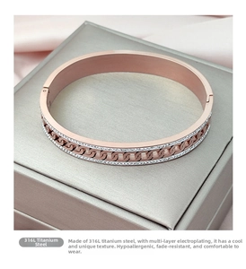 Detailed close-up of rose gold 316L titanium steel bracelet with chain link crystal inlay