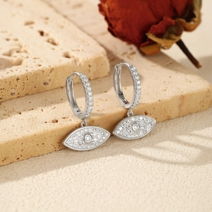 Elegant S925 sterling silver hoop earrings with sparkling diamond eye charm on a stone base