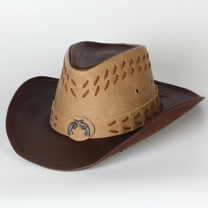 Detail of western cowboy hat with brown two-tone leather and crossed guns metal badge
