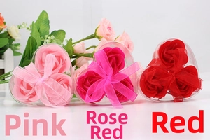 Three-piece heart-shaped soap flower gift boxes in pink, rose, and red with ribbon