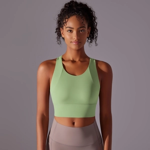 Close-up of seamless light green yoga sports bra with U-shaped neckline and high elastic fabric