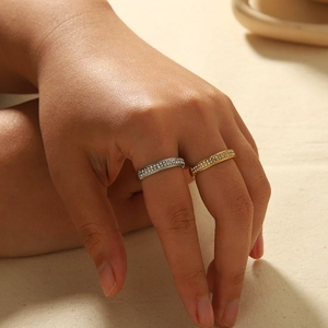 Luxury 18K gold and silver stainless steel rings with pave set zircon stones on a model