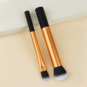 Detail of soft gradient synthetic bristles and metallic ferrule on makeup brushes