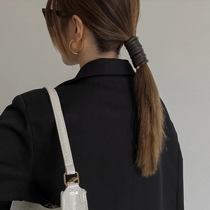 Minimalist dark brown faux leather multi-loop hair tie with elegant gold metal buckle