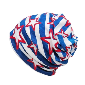 Detail of knitted slouchy beanie featuring American flag stars and stripes pattern