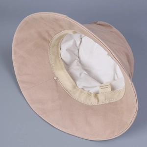 Detail of internal lining and material label of cotton blend wide brim sun hat