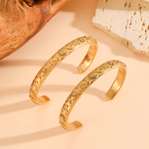 Vintage gold-plated titanium steel cuff bracelet with sun and moon celestial relief