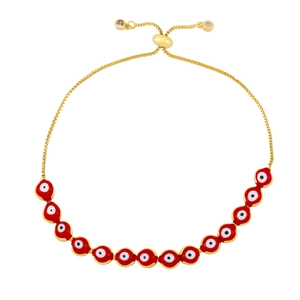 Detail of red Evil Eye charms on gold adjustable chain bracelet with sliding ball clasp