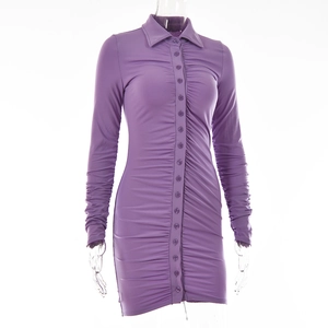 Close-up detail of the purple ruched dress with turn-down collar and buttoned front