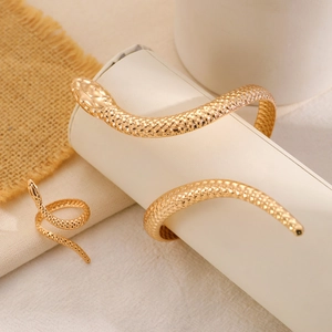 Golden snake jewelry set with textured twisted bangle and adjustable open ring