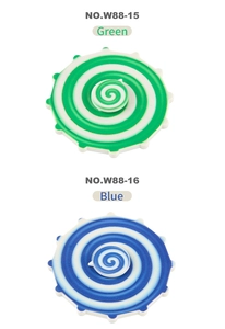 Close-up of green and blue rainbow fidget spinners with spiral gear patterns and metal bearings
