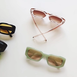 Fashionable rectangle sunglasses in assorted pastel colors on a clean white background
