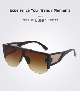 Detail of oversized rimless sunglasses with tawny gradient lenses and geometric hollow temples