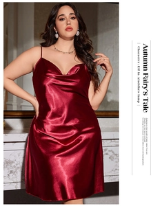 Detail of burgundy satin slip dress showing draped cowl neck and silky fabric texture