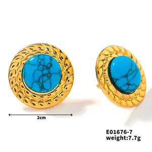 Detail of round turquoise stone earrings with gold braided metal edges, 2cm diameter