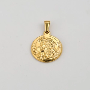 Macro detail of gold stainless steel religious pendant with Ecce Homo relief engraving