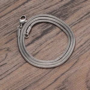 Detailed close-up of 2mm silver stainless steel snake chain necklace with lobster clasp