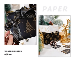 Close-up of black and gold Christmas wrapping paper with metallic snowflake and tree patterns