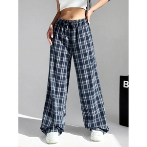 Detail of retro plaid wide-leg pants with adjustable drawstring waist and soft drape