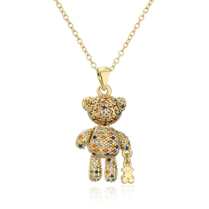 Detail of gold necklace with colorful zircon encrusted bear pendant and mini bear charm