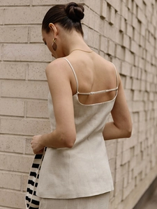 Chic beige cotton linen two-piece set featuring a strappy open-back top with sleek buttons