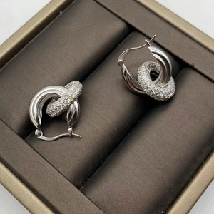 Polished silver double hoop earrings with sparkling cubic zirconia on brown gift box
