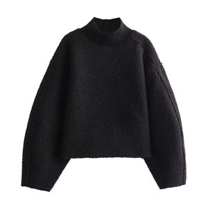 Relaxed black knit mock neck pullover sweater with a textured boucle fleece finish