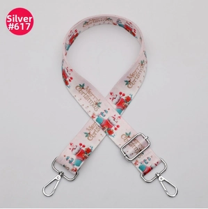 Detail of adjustable Christmas bag strap with Merry Christmas prints and silver hooks
