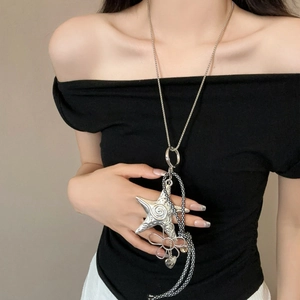 Bohemian silver necklace with starfish and flower charms on a textured leather cord