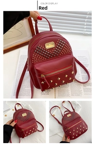 Detail view of red PU leather mini backpack featuring golden stud accents and zipper